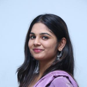 Beautiful Actress RK Dhanusha Stuns in Elegant Purple Traditional Look