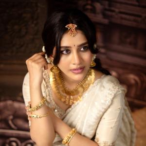 Nabha Natesh Looks Regal in an Ivory Saree and Gold Jewellery