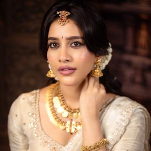 Nabha Natesh Looks Regal in an Ivory Saree and Gold Jewellery