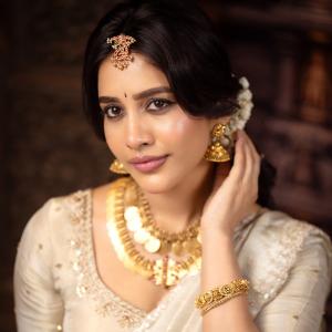 Nabha Natesh Looks Regal in an Ivory Saree and Gold Jewellery