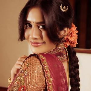 Nabha Natesh Stuns in a Maroon and Gold Saree