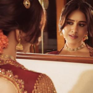 Nabha Natesh Stuns in a Maroon and Gold Saree
