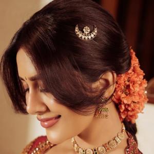 Nabha Natesh Stuns in a Maroon and Gold Saree