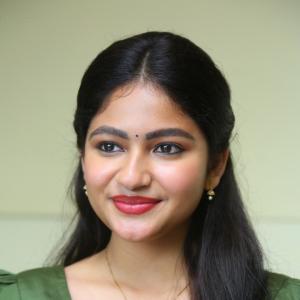 Nakshatra Shines in Green With Simple Gold Accessories