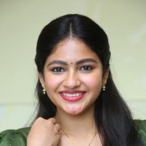 Nakshatra Shines in Green With Simple Gold Accessories