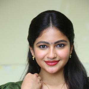 Nakshatra Shines in Green With Simple Gold Accessories