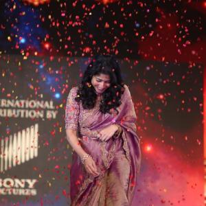 Sai Pallavi smiles in an embroidered purple outfit