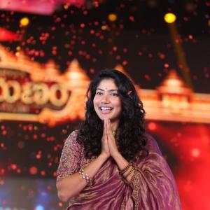 Sai Pallavi smiles in an embroidered purple outfit