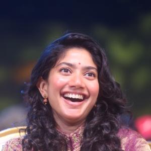 Sai Pallavi smiles in an embroidered purple outfit
