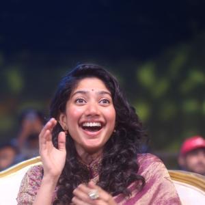 Sai Pallavi smiles in an embroidered purple outfit