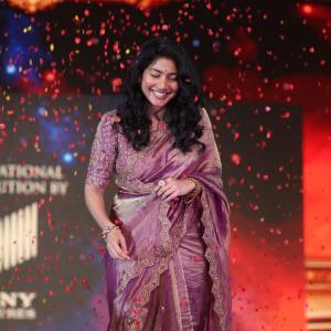 Sai Pallavi smiles in an embroidered purple outfit
