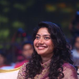 Sai Pallavi smiles in an embroidered purple outfit