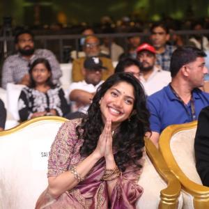 Sai Pallavi smiles in an embroidered purple outfit