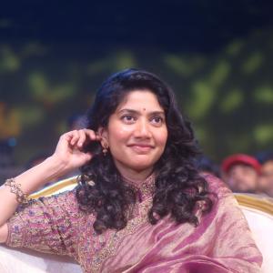 Sai Pallavi smiles in an embroidered purple outfit