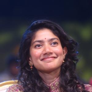 Sai Pallavi smiles in an embroidered purple outfit