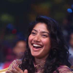 Sai Pallavi smiles in an embroidered purple outfit
