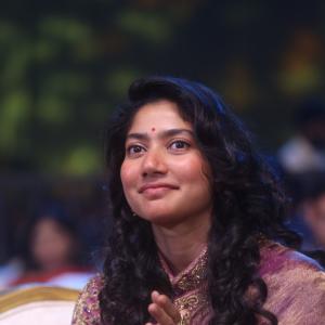Sai Pallavi smiles in an embroidered purple outfit