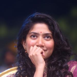 Sai Pallavi smiles in an embroidered purple outfit