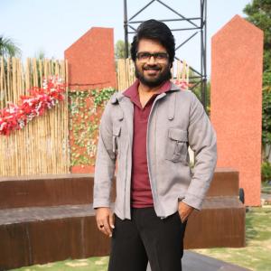 Confident Director Anil Ravipudi in Gray Jacket and Maroon Polo Shirt Look