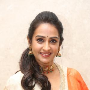 Actress Laya Elegant Ethnic Look in Cream Anarkali with Orange Dupatta