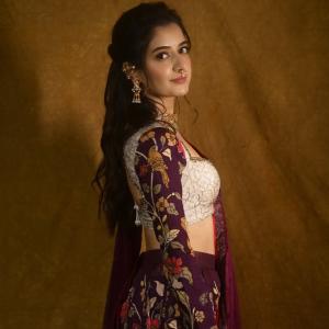 Graceful Smile of Actress Ashika Rangnath in Floral Elegance