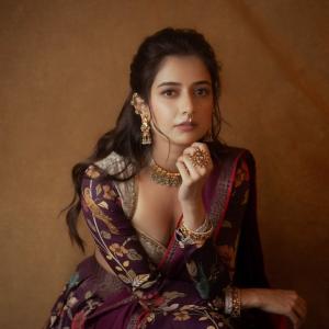 Graceful Smile of Actress Ashika Rangnath in Floral Elegance