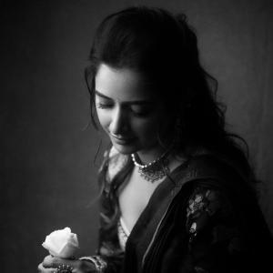 Graceful Smile of Actress Ashika Rangnath in Floral Elegance