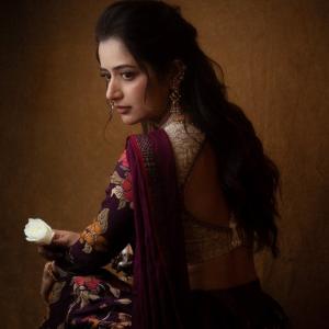 Graceful Smile of Actress Ashika Rangnath in Floral Elegance