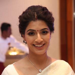 Graceful Actress Vara Lakshmi Sarat Kumar Dressed in White Saree