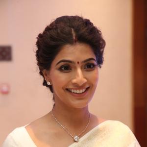 Graceful Actress Vara Lakshmi Sarat Kumar Dressed in White Saree