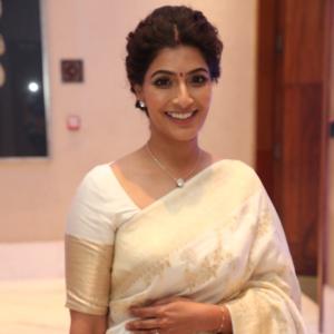 Graceful Actress Vara Lakshmi Sarat Kumar Dressed in White Saree