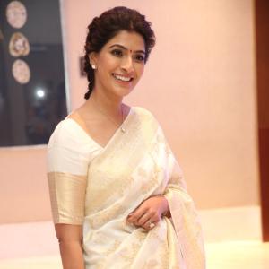 Graceful Actress Vara Lakshmi Sarat Kumar Dressed in White Saree