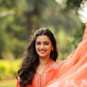 Radiant Actress Bhagya Sri Borse in Orange Traditional Attire