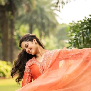 Radiant Actress Bhagya Sri Borse in Orange Traditional Attire