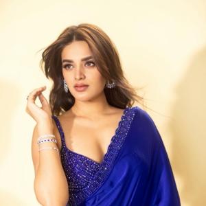 Actress Nidhi Agarwal Stuns in a Blue Embellished Saree