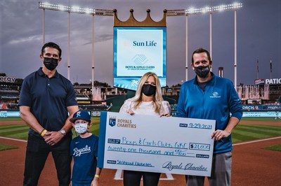 (From left to right): Lance Kappelman, Sun Life; son Voss; Amanda Grosdidier, Royals Charities; Jason Roth, Boys and Girls Clubs of Greater Kansas City