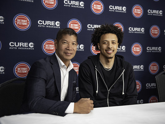 Eric S. Poe, CEO, CURE auto insurance and Cade Cunningham, Detroit Pistons 2021 #1 overall draft pick (PRNewsfoto/CURE Auto Insurance)