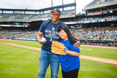 Elisabeth Heath, M.D., FACP, leader of the Genitourinary Oncology Multidisciplinary Team at Karmanos Cancer Institute, catches the ceremonial first pitch from a prostate cancer survivor.