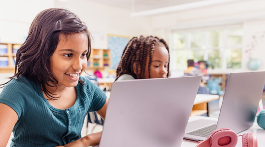Two students on laptops hmhpp popout WF2187750