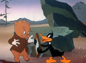 Screenshots from the 1944 Warner Bros. cartoon Duck Soup to Nuts
