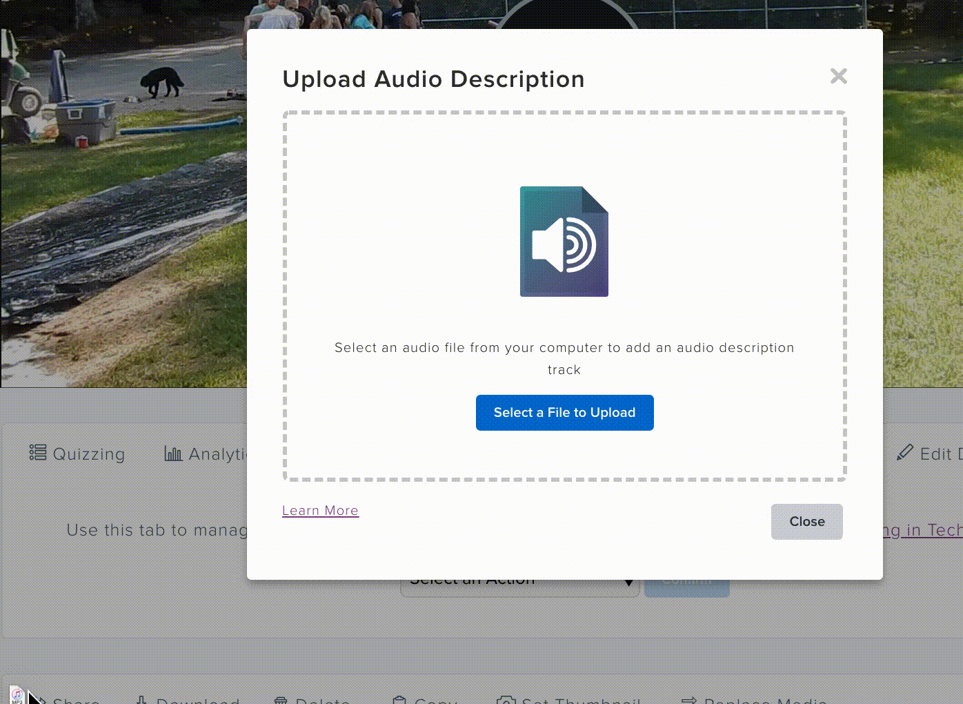 .gif of mp3 being dragged and dropped into the Audio Description Upload section