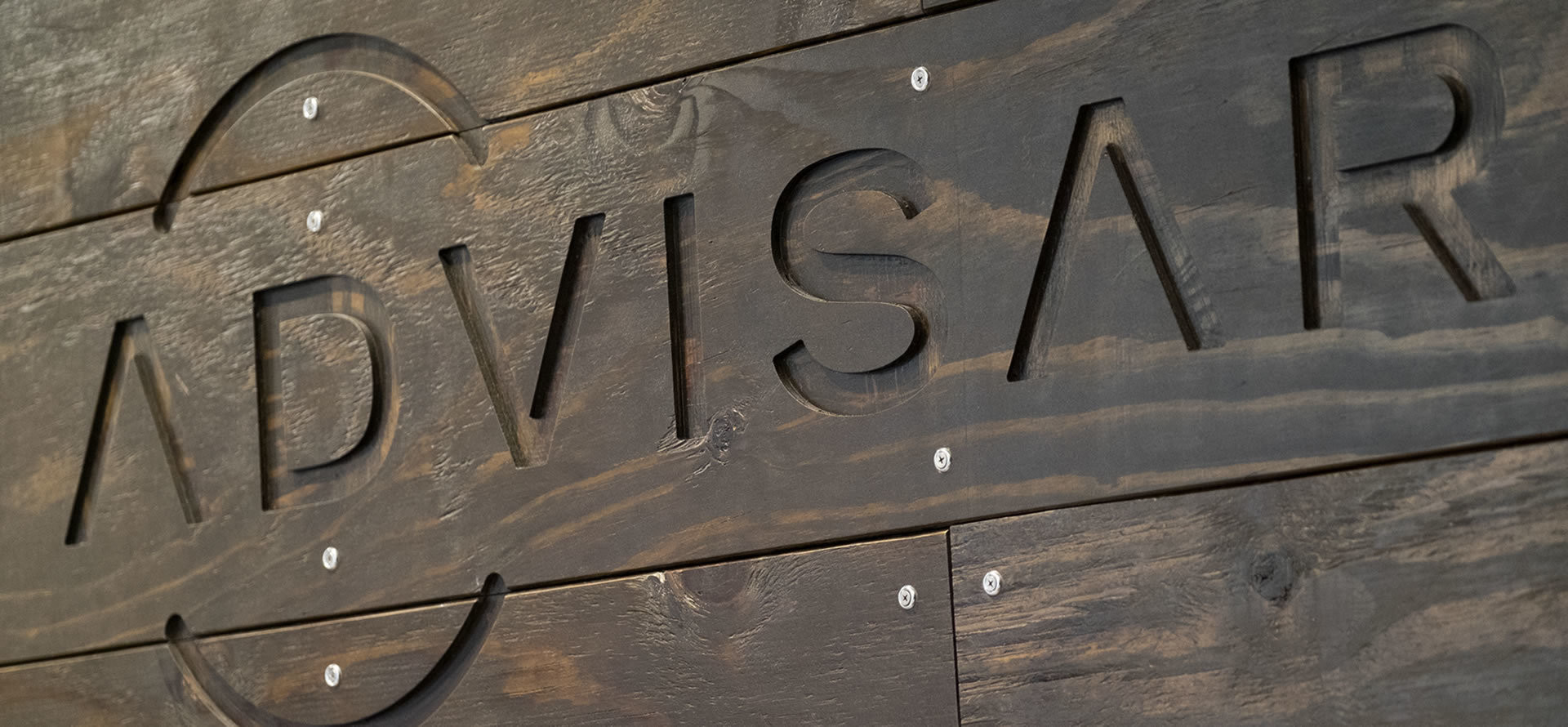 Advisar logo on wood