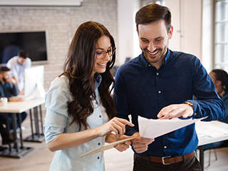 Couple reviewing checklist on IntouchCheck mobile forms software
