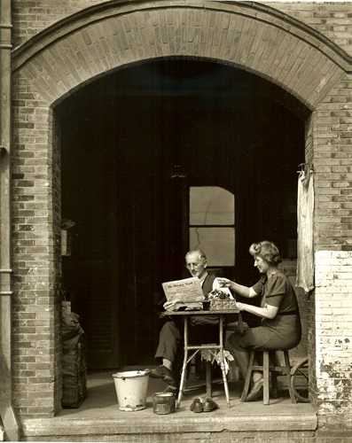 Reading German language edition of Shanghai Herald, Shanghai, April 1946