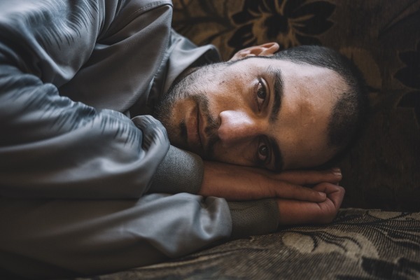 Mohamed Khaled Krayem, free after seven years in prison for marijuana possession, finds his muscle memory instinctively reproduces the sleeping position he was forced to adopt in his crowded cell. Damascus, Syria, 15 December 2024