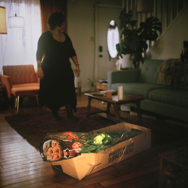 A death doula, an end-of-life companion, prepares for a guest’s death with flowers. The service is free of charge because the experience is grounded in community care, not profit. 1 March 2024