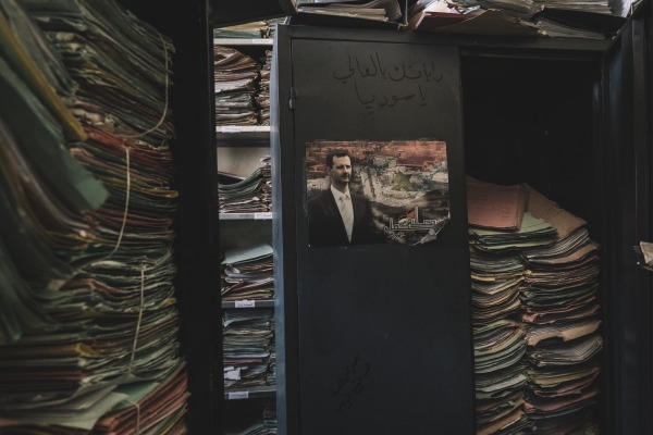 Personal files left piled in the infamous “Palestine Branch” interrogation and detention center. Human rights groups estimate at least 150,000 people went missing under Assad’s regime. Damascus, Syria, 18 December 2024