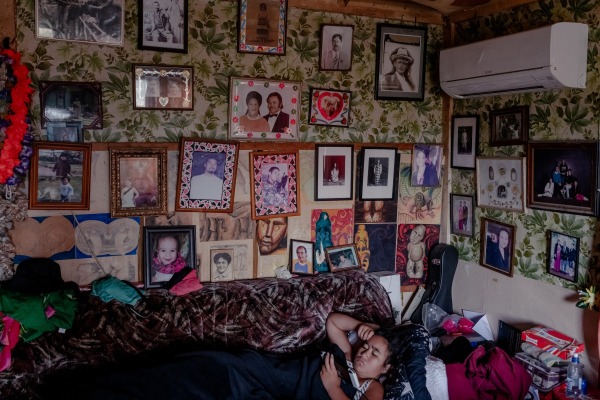 Ruiha Te Tana (12) relaxes at her grandfather's home. Built by an ancestor in 1916, the homestead serves as a living archive of Tūhoe history. Ruatoki, New Zealand, 26 January 2022