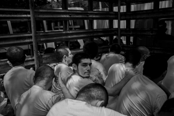 A group of arrested people awaits entrance to Ilopango jail. Many will spend over a year behind bars without due process. Trials are conducted in groups rather than on a case-by-case basis. Ilopango, San Salvador, El Salvador, 27 September 2022