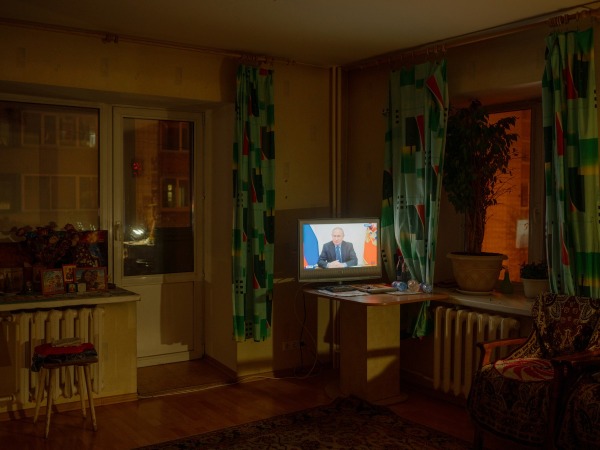 Since Aliona’s grandmother very rarely leaves the house, television (here broadcasting an address by President Putin) is often her window to the world. Tomsk, Russia, 12 January 2023